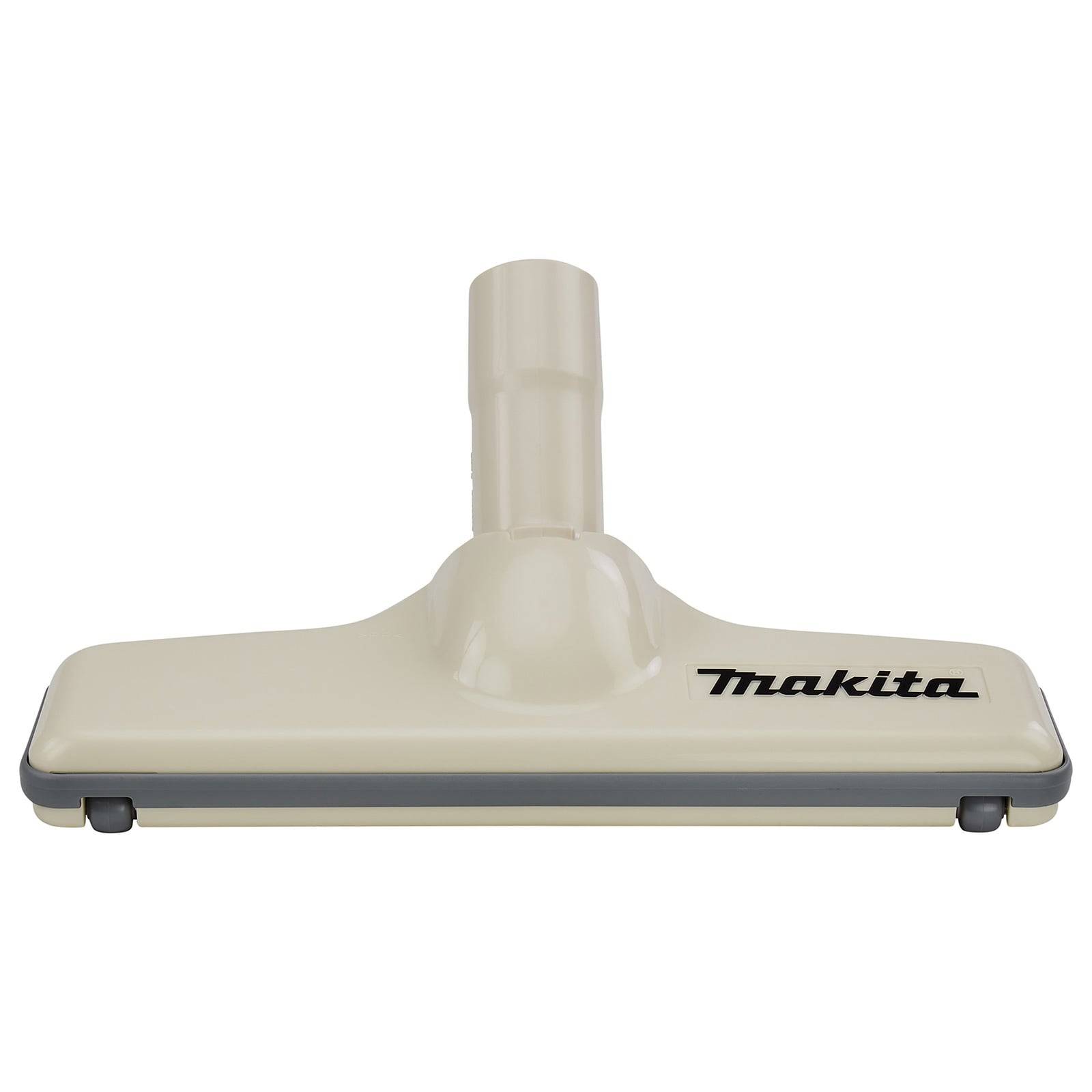 Eine Staubsauger-Bodendüse der Marke 'Makita' in schwarzer Schrift auf einer hellen Oberfläche, konzipiert für die Reinigung von flachen Flächen.