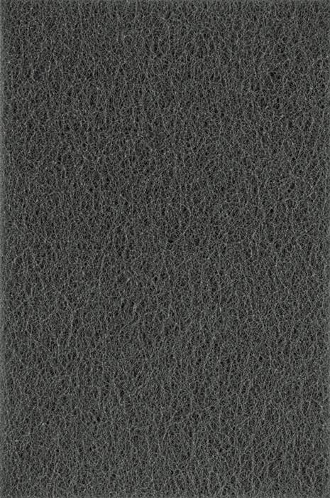 Nahaufnahme einer dunkelgrauen, grob texturierten Oberfläche mit einem komplizierten netzartigen Muster.