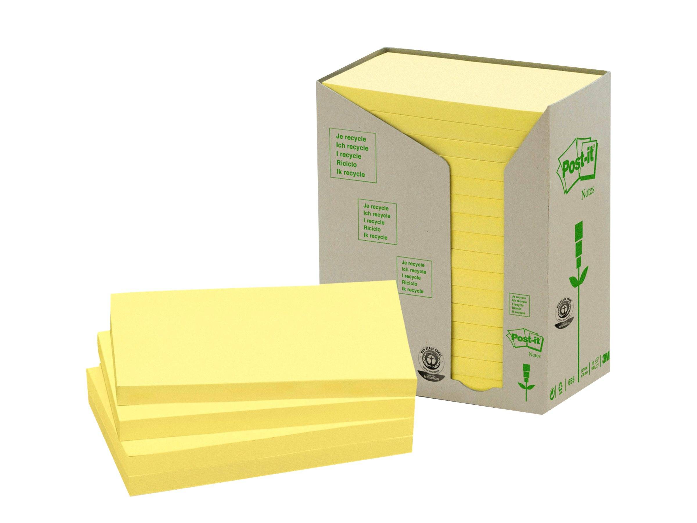 Verpackte gelbe Haftnotizen mit einem Stapel loser Notizen vor der Spenderbox.