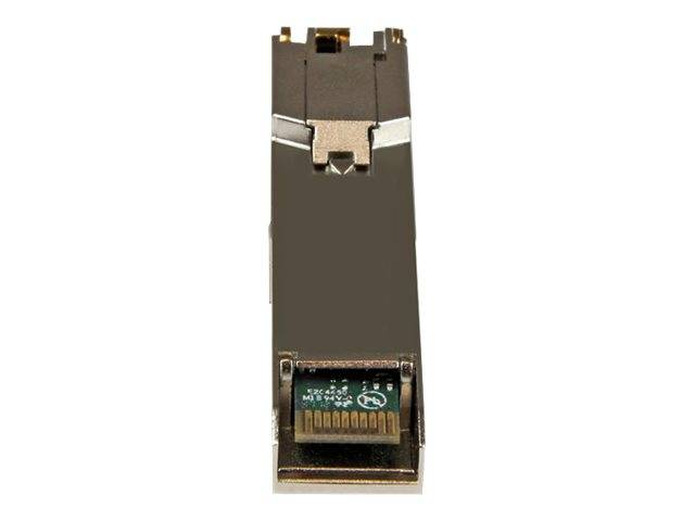 Nahaufnahme eines kleinen elektronischen Steckermoduls mit Metallgehäuse und einem sichtbaren Leiterplattenstecker an der Unterseite.