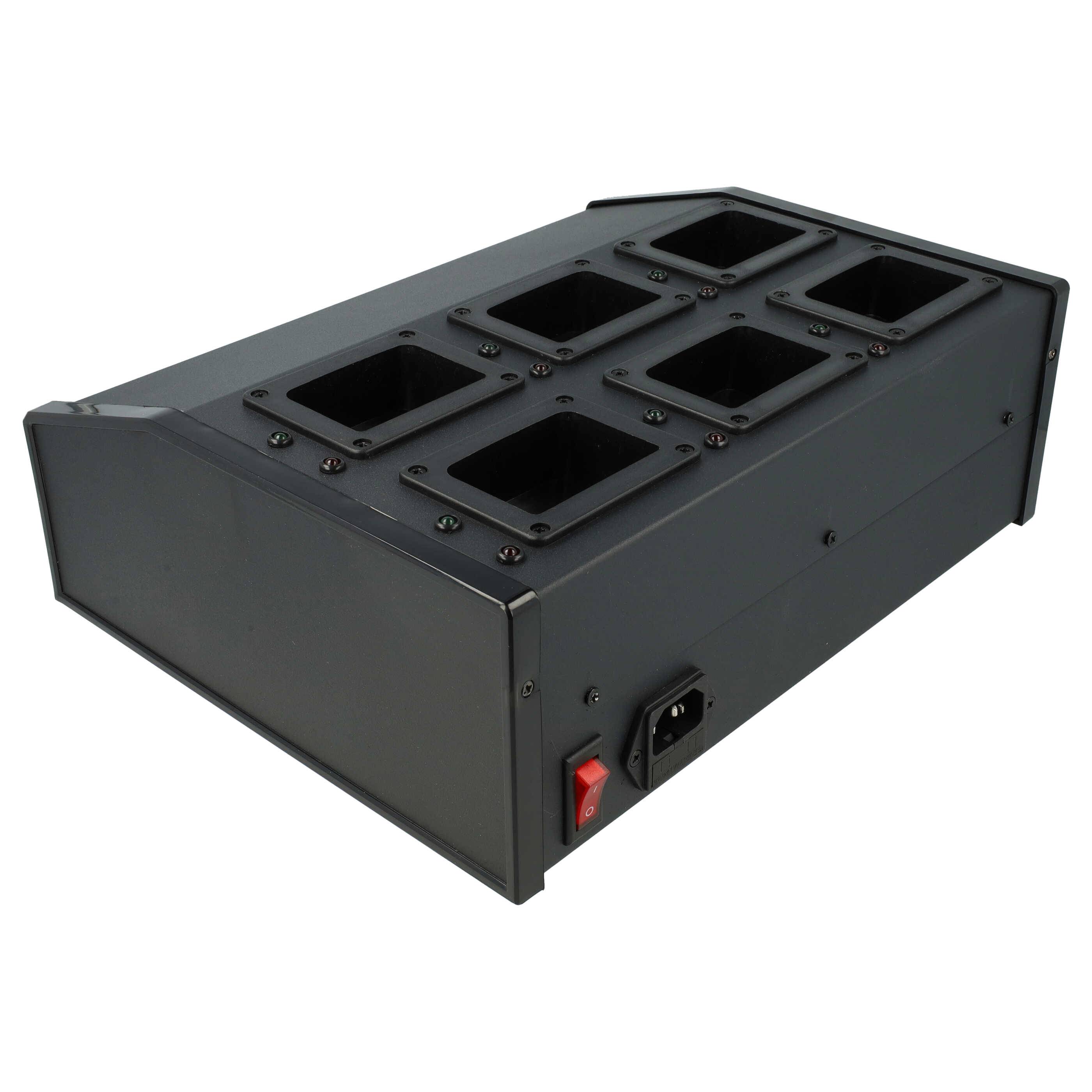 Ein schwarzes elektronisches Gerät mit mehreren quadratischen Steckplätzen und einem Netzschalter, wahrscheinlich zum Laden oder Aufbewahren von Gegenständen genutzt.