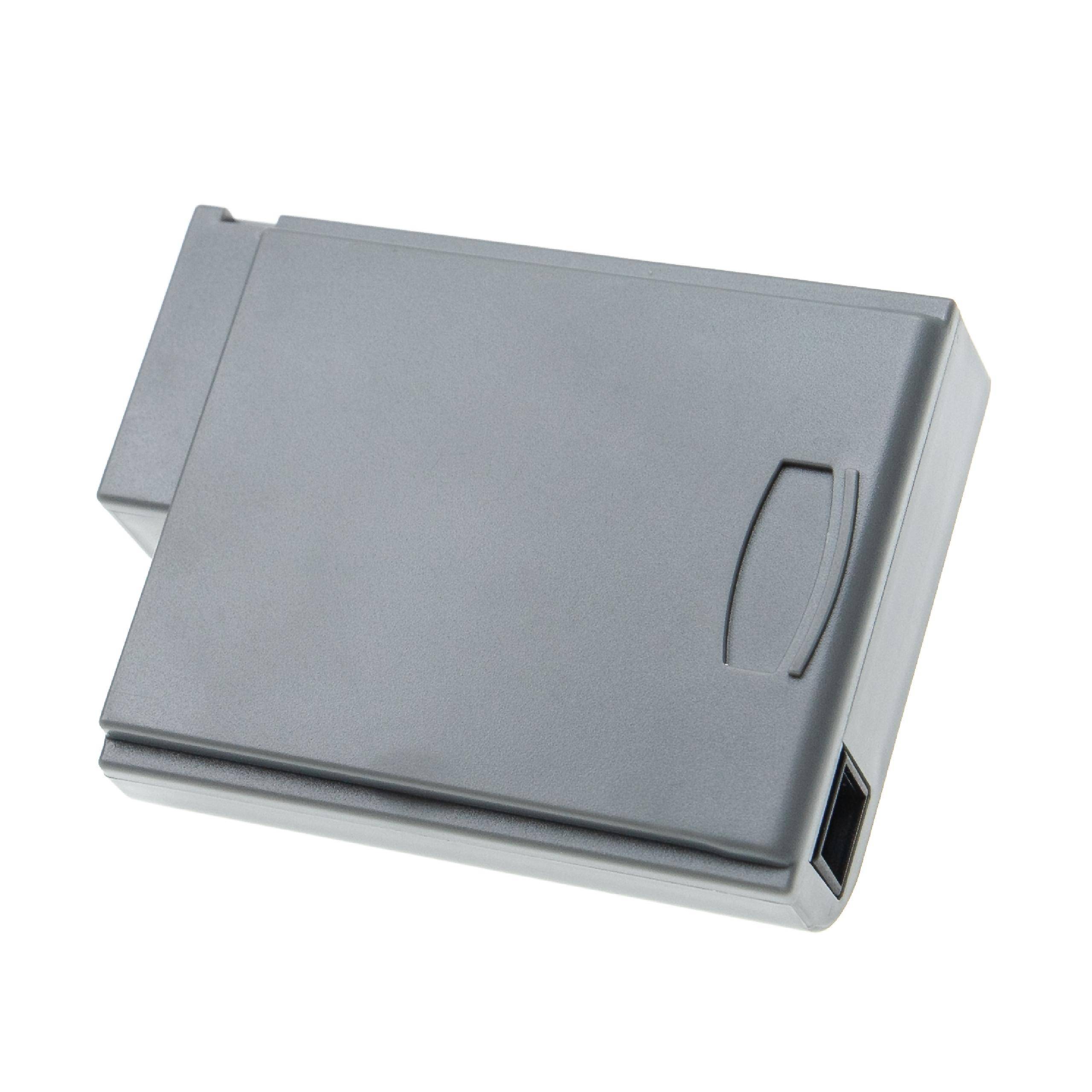 Ein graues rechteckiges elektronisches Gerät, möglicherweise eine Batterie oder Stromversorgungseinheit, mit einer Anzeigekerbe und einem Anschlussport an der Seite.