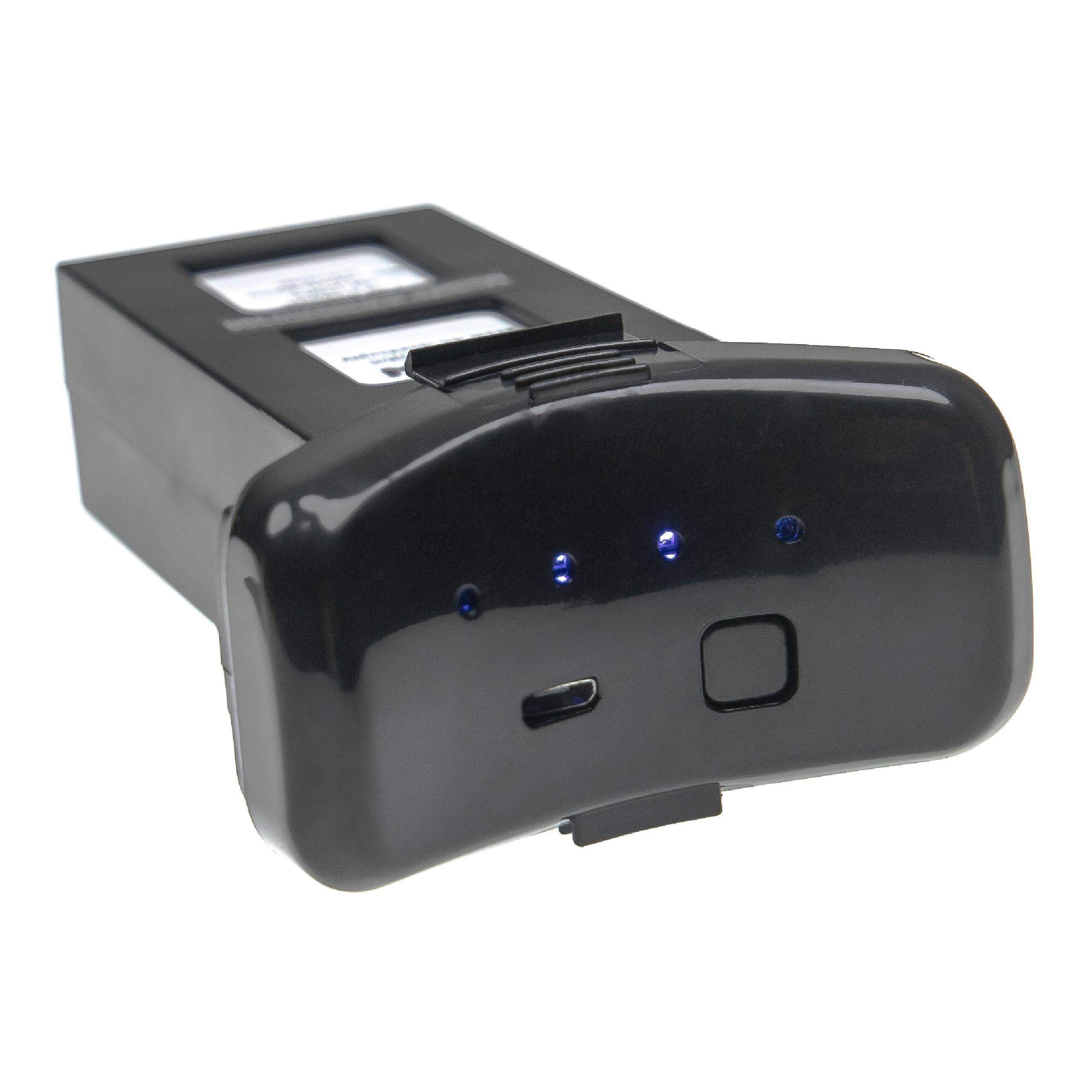 Schwarzes tragbares elektronisches Gerät mit vier blauen Anzeigelichtern, einer Taste und einem USB-Anschluss an der Vorderseite.