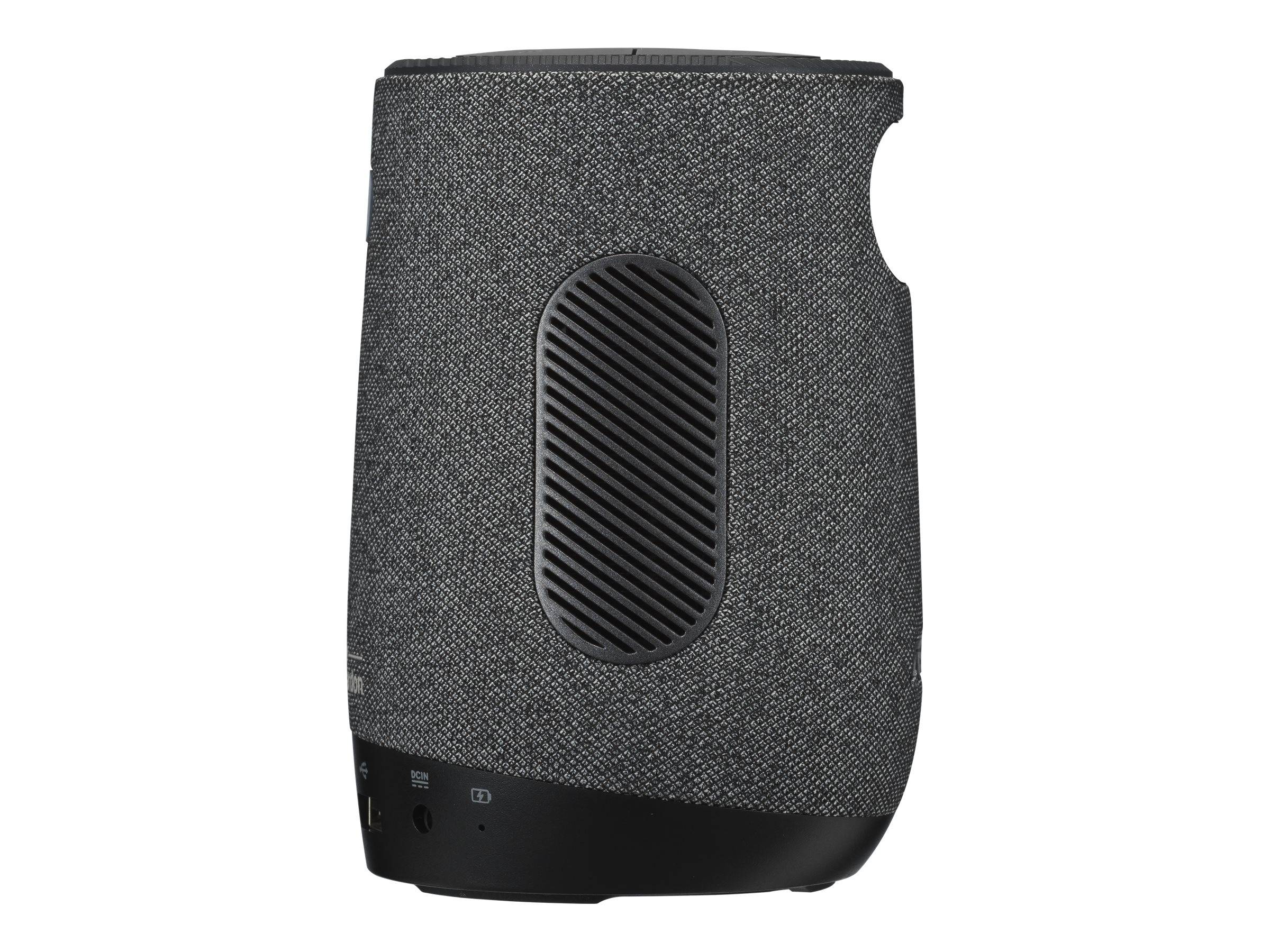 Tragbarer Bluetooth-Lautsprecher mit grauem Stoffüberzug, schwarzem Sockel und frontalem Gitter.