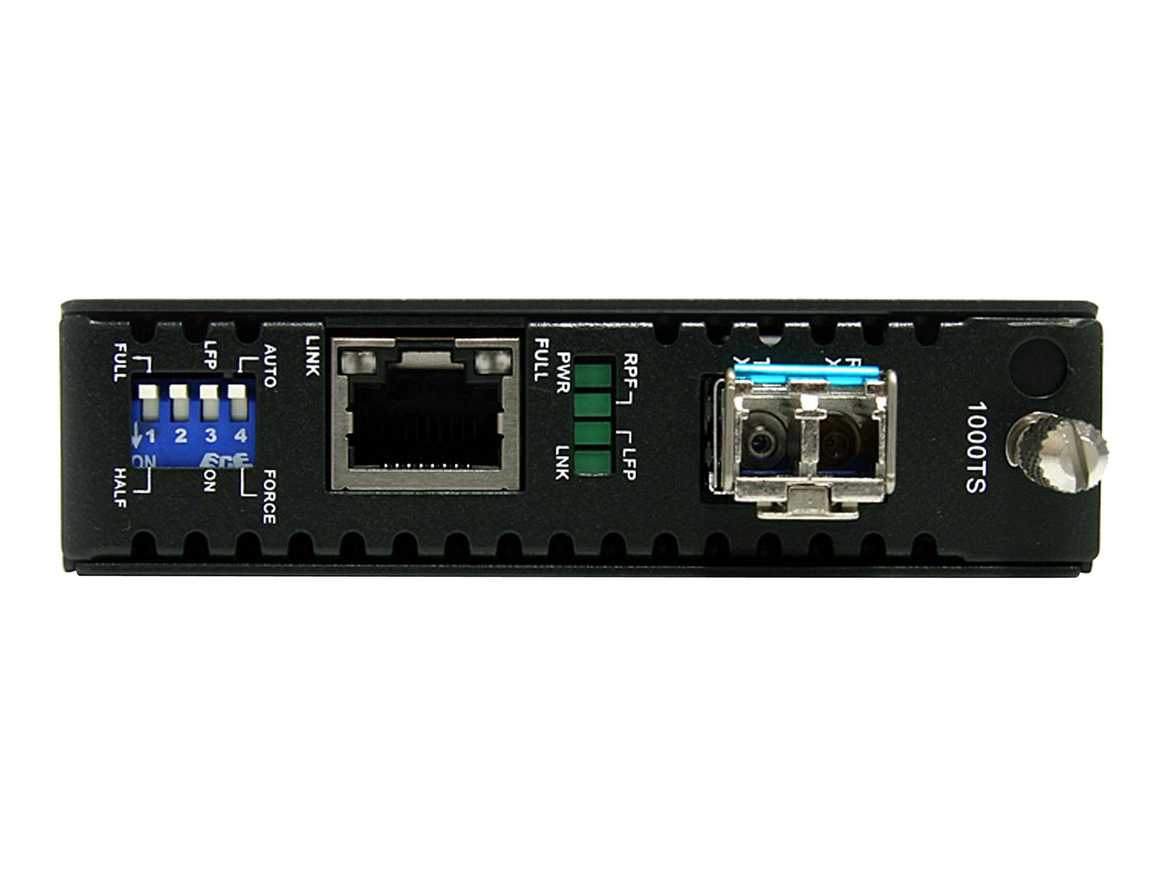 Vorderansicht eines schwarzen Ethernet-Netzwerk-Switches mit blauen DIP-Schaltern, einem RJ45-Anschluss, Status-LEDs und einem Glasfaser-Anschluss.