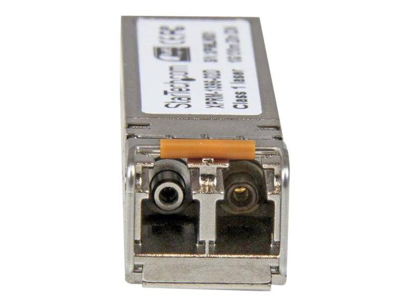 Nahaufnahme eines Faseroptik-Transceiver-Moduls mit zwei frontseitig angebrachten Anschlüssen und einem Etikett auf der Oberseite.