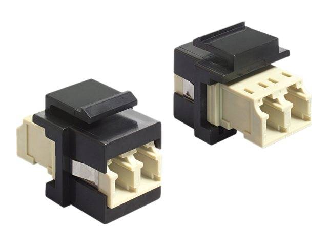 Zwei schwarze und beige Elektrostecker-Adapter auf weißem Hintergrund gezeigt.