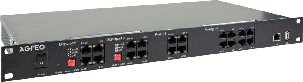 Schwarzer Netzwerk-Switch mit mehreren Ethernet-Ports, beschriftet von UP0 bis UP5, und Kippschaltern mit den Bezeichnungen Ext-S0, Int-S0. Port 2 ist ein Digitalport.