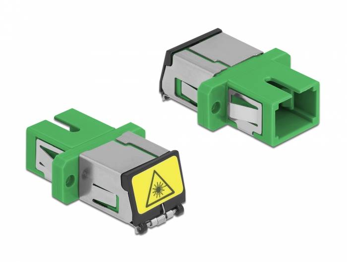 Zwei grüne und silberne Glasfaserkonnektoren, einer mit einer gelben Laserwarnung auf der Vorderseite.