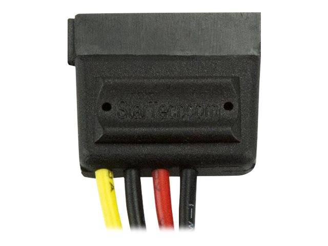 Nahaufnahme eines schwarzen Elektrosteckers oder Sensorgehäuses mit vier farbigen Drähten, die gegen einen weißen Hintergrund angebracht sind.