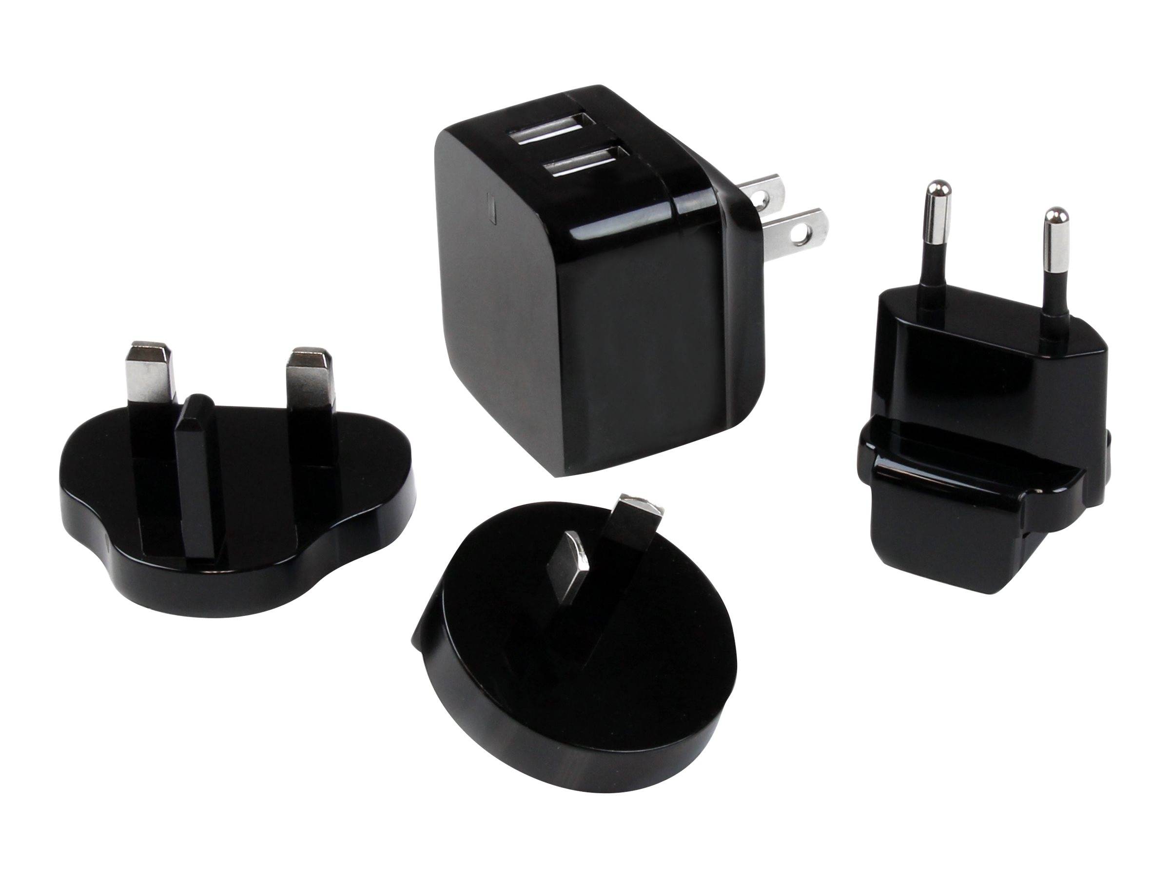 Vier schwarze USB-Wandladegeräte mit verschiedenen Steckertypen, gezeigt auf weißem Hintergrund.