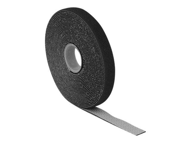 Eine schwarze Rolle selbstklebende Klettverschlussband mit einem abgerollten Streifen auf weißem Hintergrund.