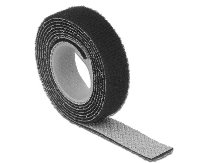 Eine Rolle schwarzes selbstklebendes Klettverschluss-Klebeband mit einem grauen Rückenstreifen, ausgebreitet auf weißem Hintergrund.