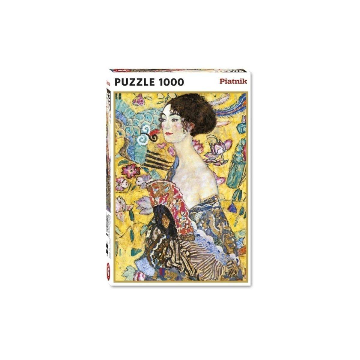 Schachtel eines 1000-teiligen Piatnik-Puzzles mit einem farbenfrohen Porträt einer Frau in einer Szene mit Blumenmuster.
