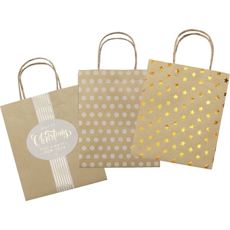 Drei festliche Geschenktüten: eine mit der Aufschrift 'Fröhliche Weihnachten', eine mit silbernen Polka Dots bedeckt und eine mit goldenen Sternen verziert.