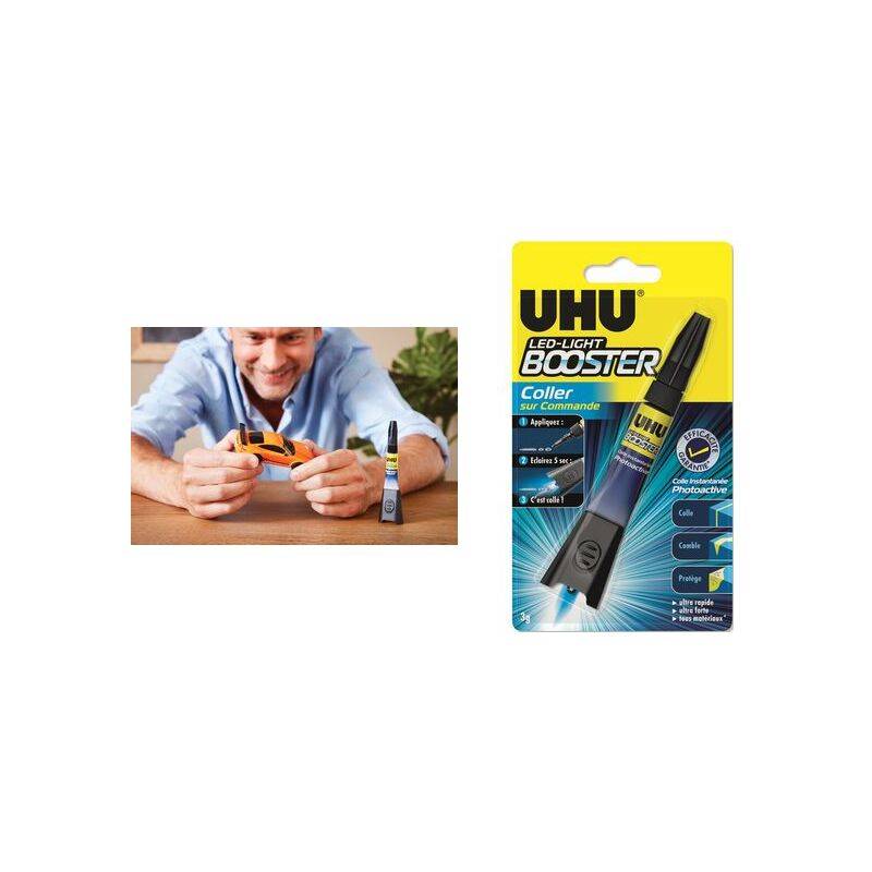 Ein Mann verwendet den UHU LED-Lichtbooster-Kleber, der neben seiner Verpackung gezeigt wird. Der Kleber ist für präzise Anwendung mit integrierter LED-Beleuchtung konzipiert.