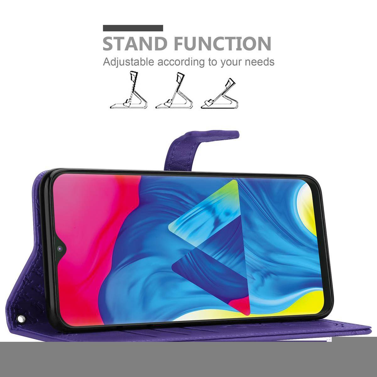 Cadorabo Hülle für Samsung Galaxy A10 / M10 Schutz Hülle in Lila Handyhülle Cover Etui Case Booklet Hunde Katzen
