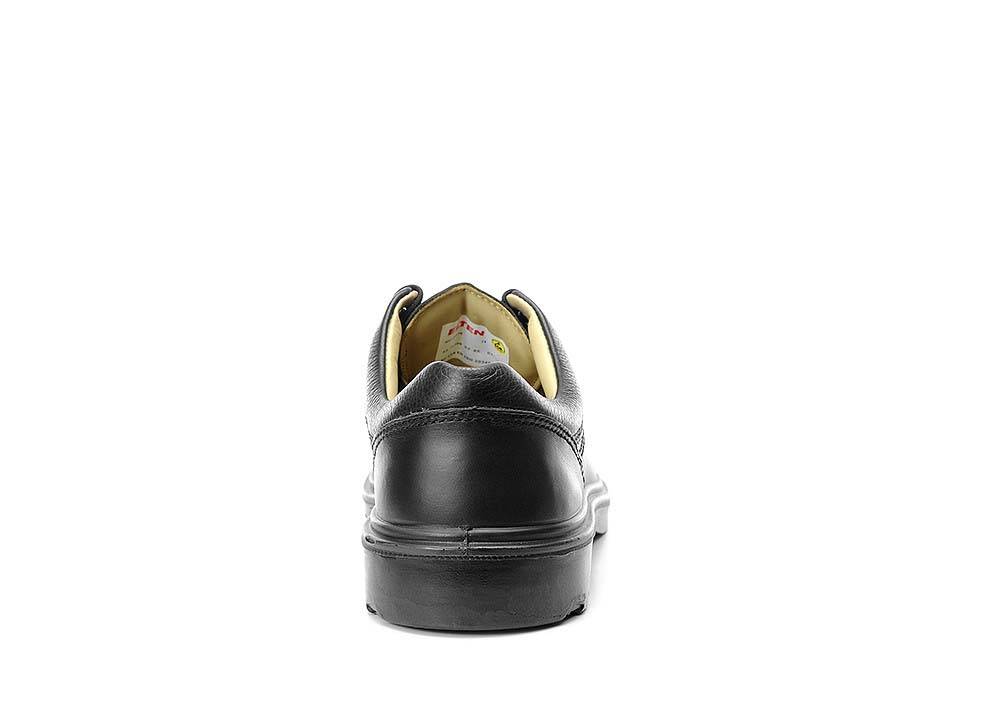 Schwarzer Lederschuh, von hinten gesehen, mit sichtbarer gelber Fütterung und Steppnahtdetails.