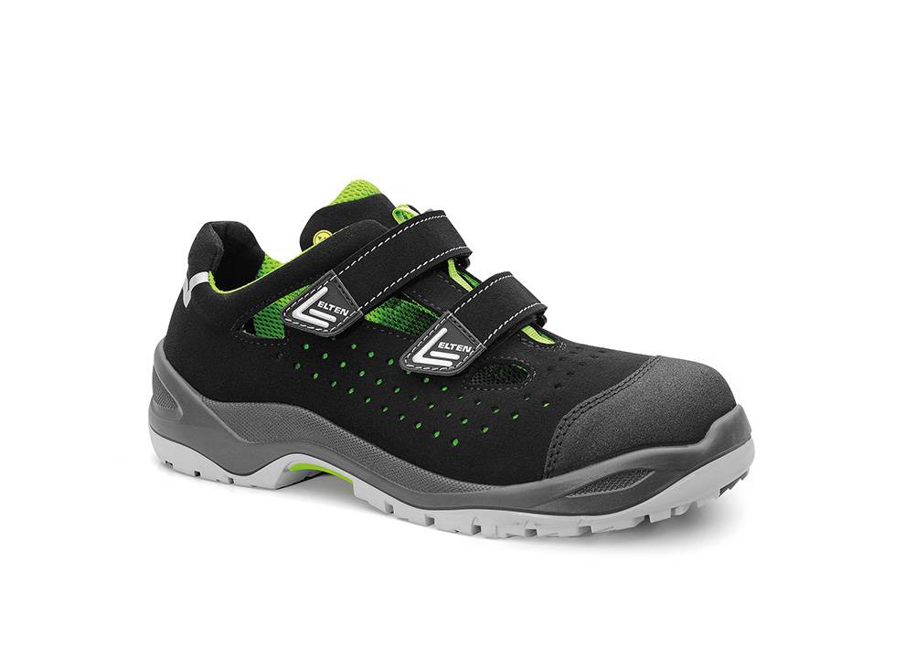 Ein schwarzer und grüner Sicherheitsschuh mit Klettverschlüssen und einer grauen rutschfesten Sohle, konzipiert für langlebiges Tragen in industriellen Umgebungen.