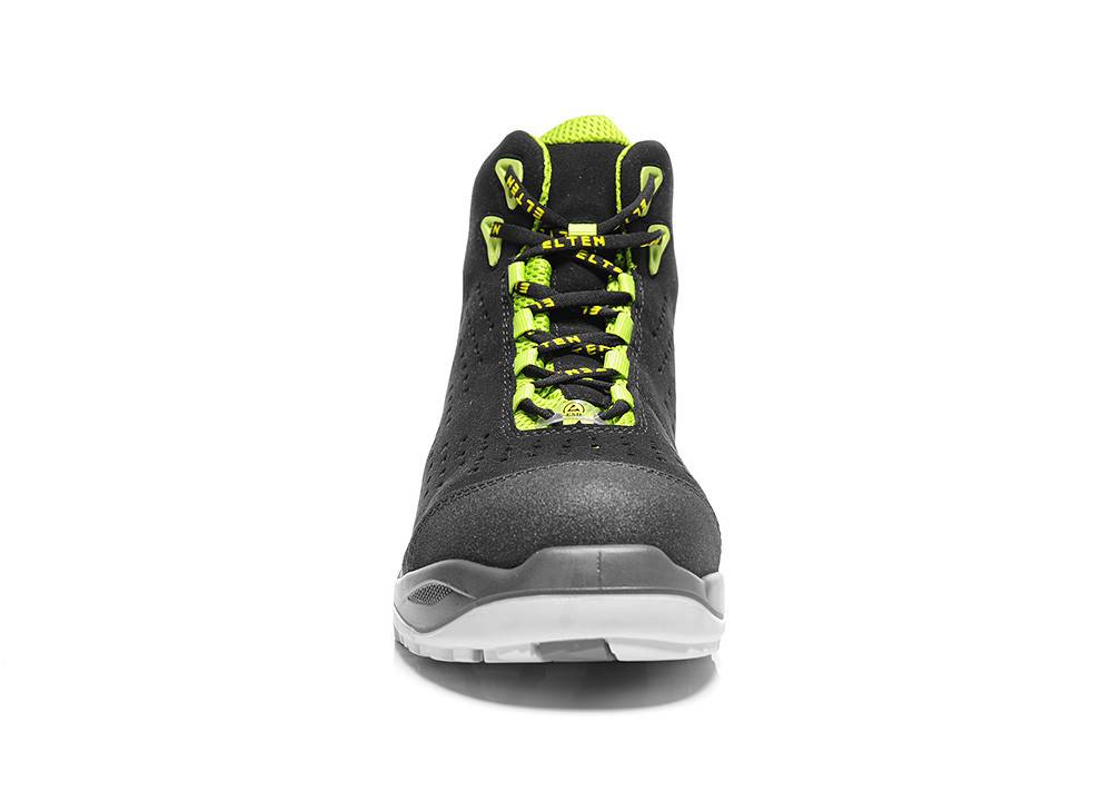 Ein schwarzer und neongrüner Sportschuh, von vorne betrachtet, der seine leuchtenden Schnürsenkel und das moderne Design präsentiert.