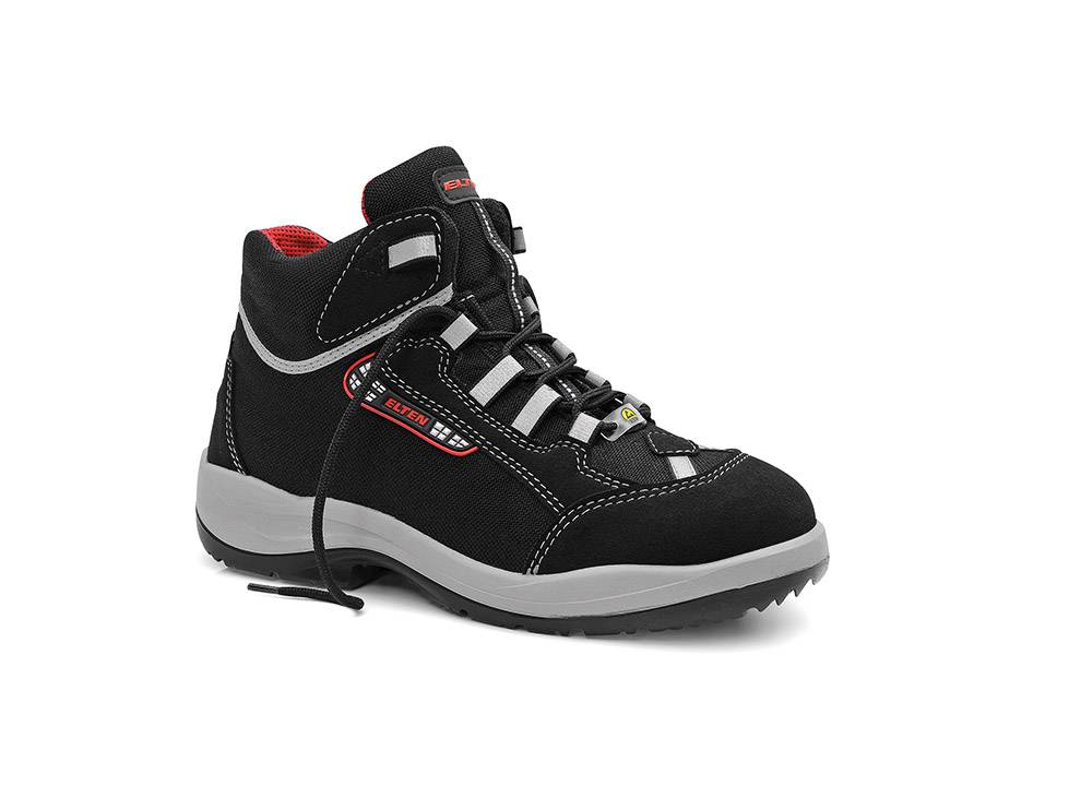 Ein schwarzer und roter Wanderschuh mit verstärkter Zehenkappe, Schnürverschluss und einer robusten Sohle, die für Outdoor-Aktivitäten auf unterschiedlichen Geländearten entwickelt wurde.