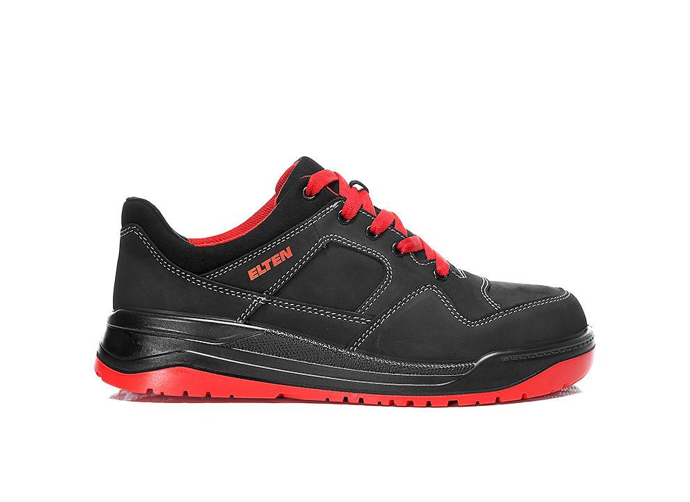 Ein schwarzer und roter Turnschuh mit 