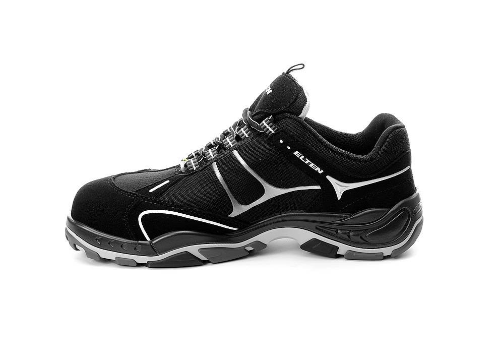 Ein schwarzer Sportschuh mit weißen und grauen Akzenten, ausgestattet mit einer robusten Sohle und Schnürverschluss, geeignet für Sport oder lässige Freizeitaktivitäten.