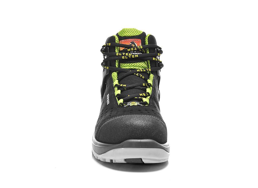 Ein schwarzer und grüner Sportschuh, der nach vorne gerichtet ist, mit einem mutigen Design und einer robusten Sohle, der sich sowohl für Sport als auch für den Freizeitgebrauch eignet.