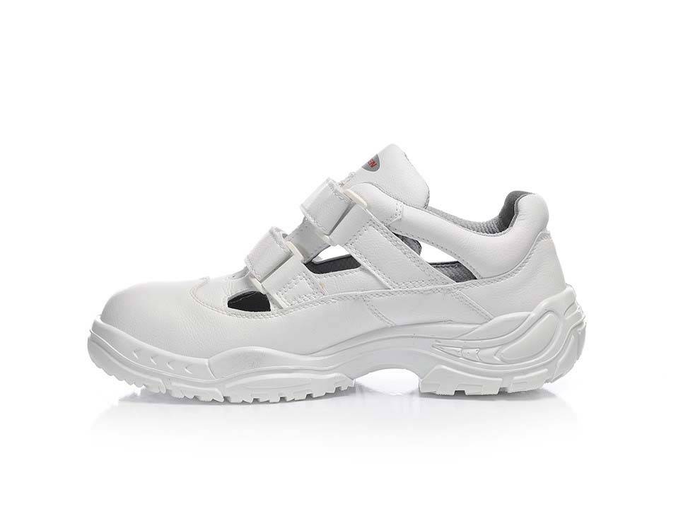 Ein weißer Schutzschuh mit Klettverschlüssen und einer robusten Sohle, der für Sicherheit und Komfort konzipiert ist.
