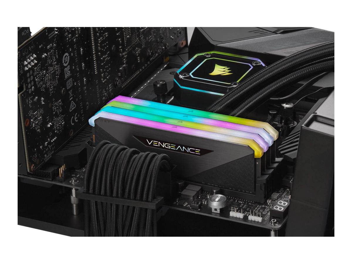 Nahaufnahme des Inneren eines Desktop-PCs mit Corsair Vengeance RGB-Speichermodulen mit Regenbogenbeleuchung neben einem Corsair-Flüssig-CPU-Kühler und Kabelmanagement.