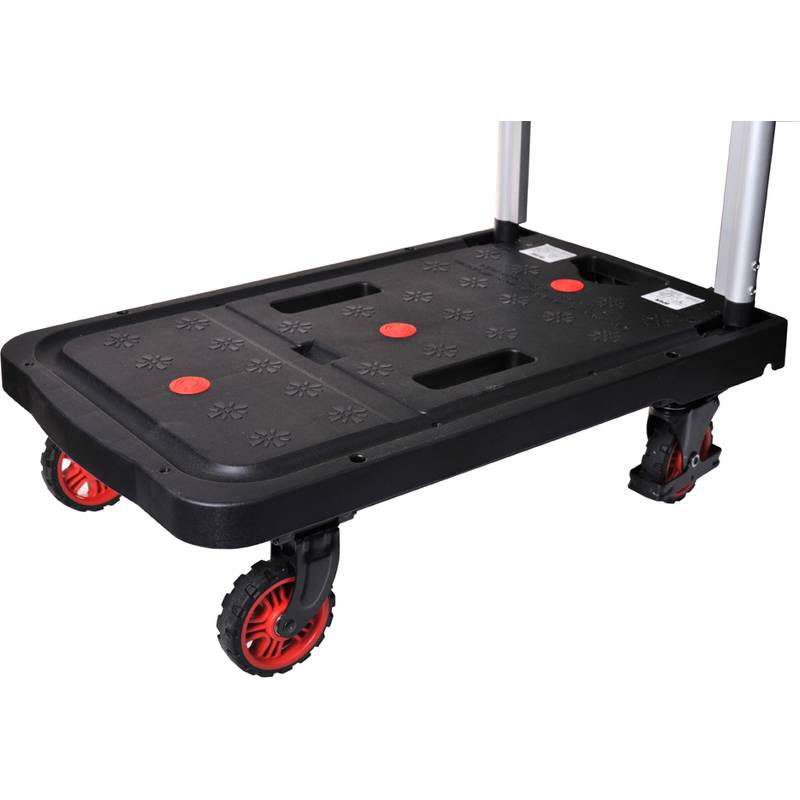 Ein schwarzer und roter Plattformwagen mit vier Rädern und einer flachen Oberfläche, entwickelt zum Transport schwerer Gegenstände.