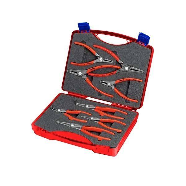 Offener roter Transportkoffer mit mehreren orange-gefassten Seegeringzangen, die in Schaumstoffaussparungen angeordnet sind.