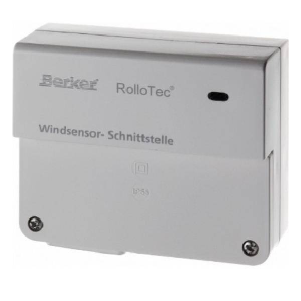 Ein weißes Berker RolloTec Windsensor-Schnittstellengerät mit zwei sichtbaren Schrauben und einem kleinen schwarzen Indikator, beschriftet mit 'Windsensor-Schnittstelle.