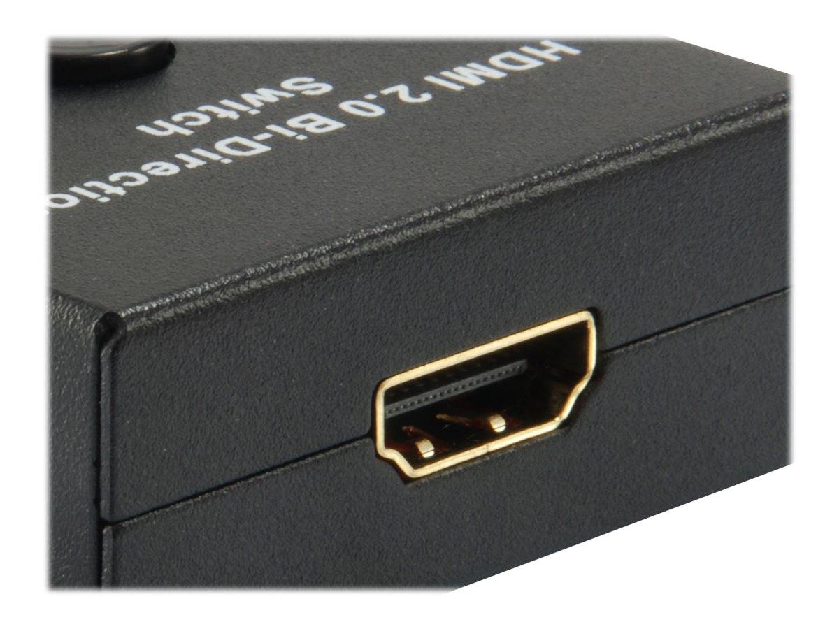 Nahaufnahme einer schwarzen HDMI 2.0 bidirektionalen Switchbox mit einem vergoldeten HDMI-Anschluss auf der Vorderseite.