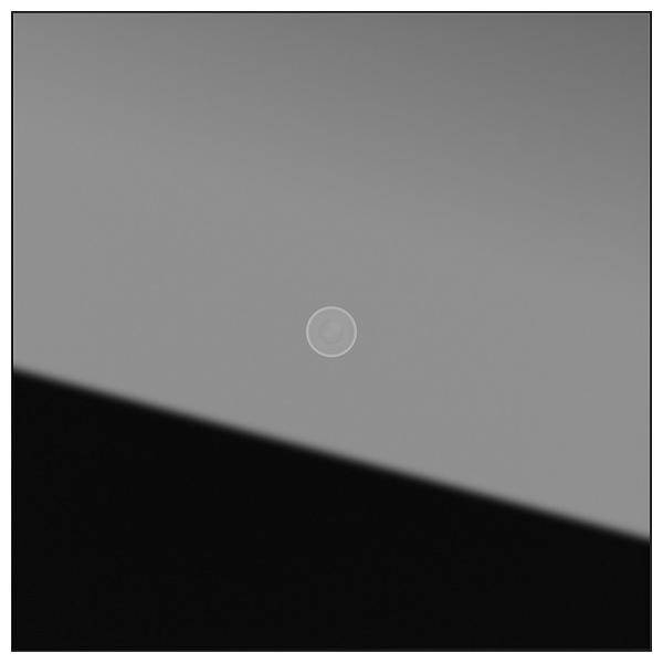 Ein Graustufenbild zeigt einen zentralen Kreis vor einem Verlaufshintergrund, der von hellgrau an der Spitze zu Schwarz am unteren Rand übergeht.