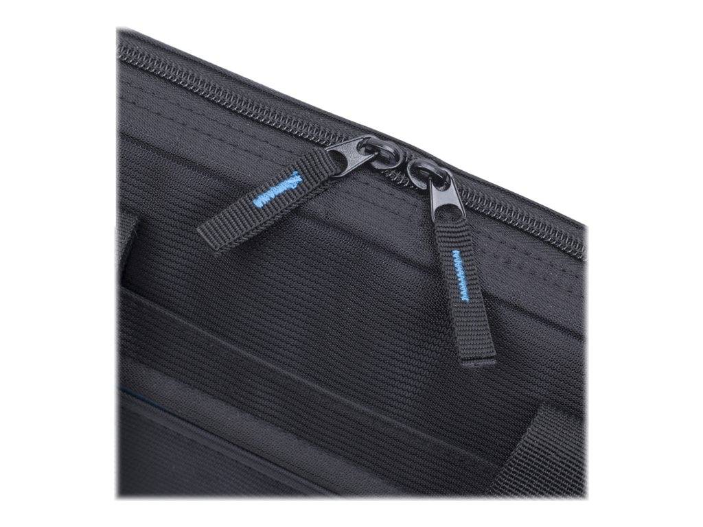Nahaufnahme einer schwarzen Stofftasche, die zwei Reißverschlusszüge an einer Taschtenöffnung zeigt.