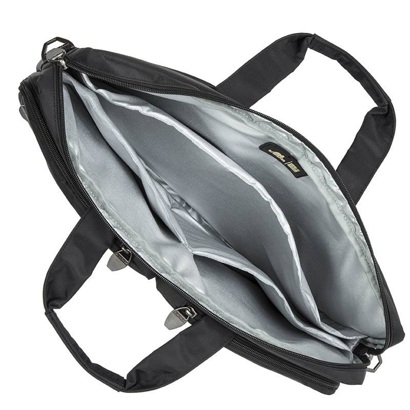 Offene schwarze Laptoptasche mit Reißverschluss, zwei Griffen und gepolsterten grauen Innenfächern, von oben auf weißem Hintergrund gezeigt.