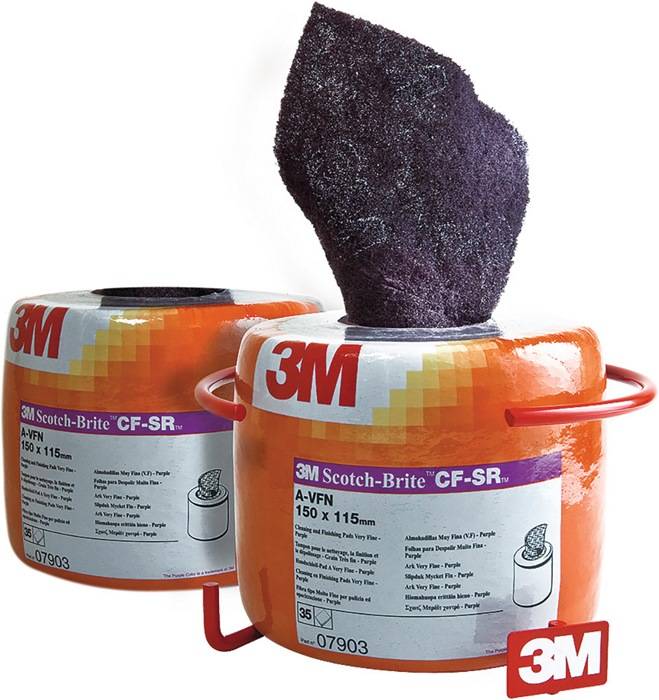 3M Scotch-Brite CF-SR' Rolle mit Fasertextur-Muster auf der Oberseite. Helle Verpackung mit Produktdetails zur Größe: 150x115mm.