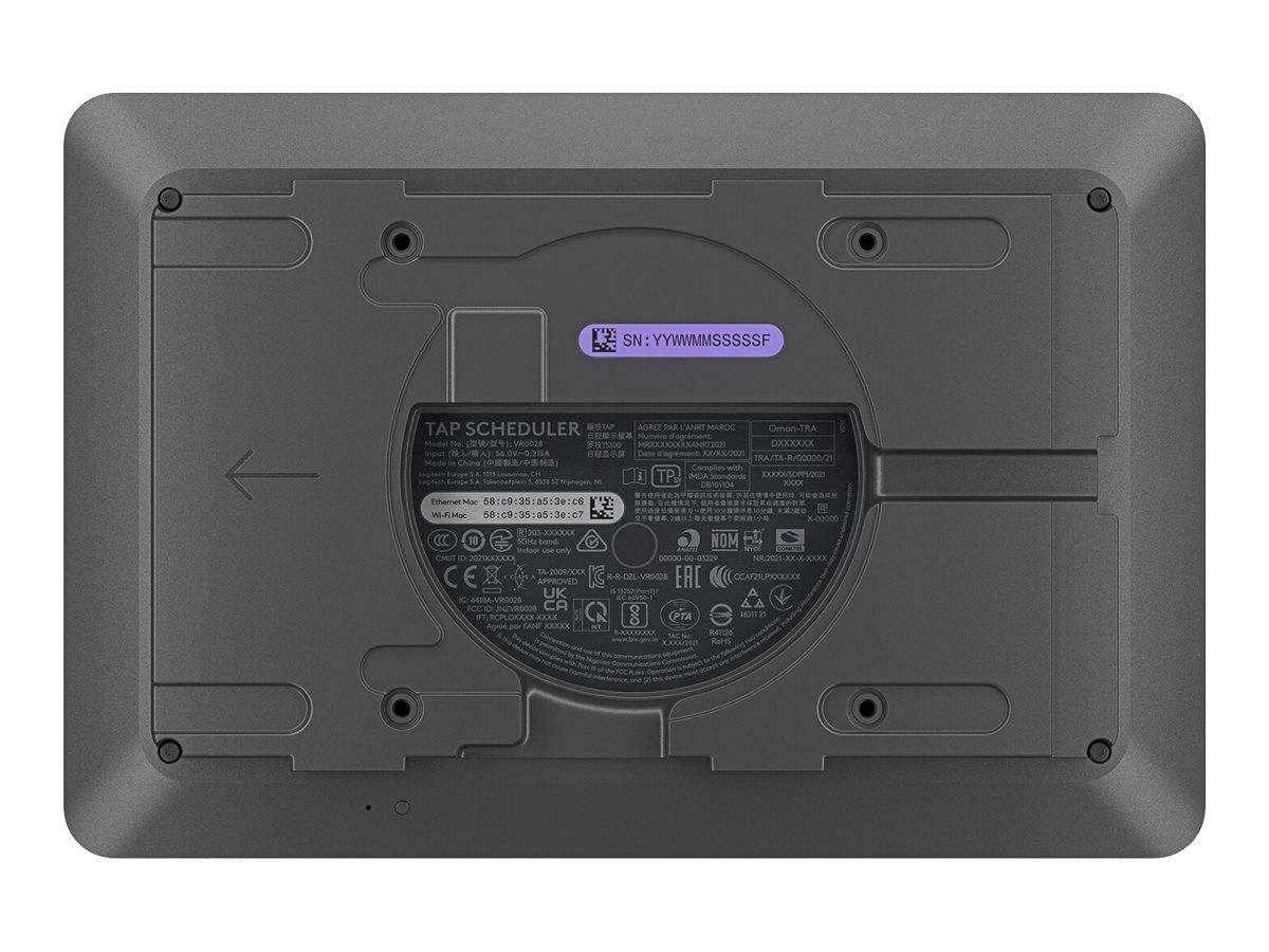 Rückansicht eines schwarzen Tap Scheduler-Geräts mit Montagepanel, Schraubenlöchern und einem zentralen Etikett mit Seriennummer.