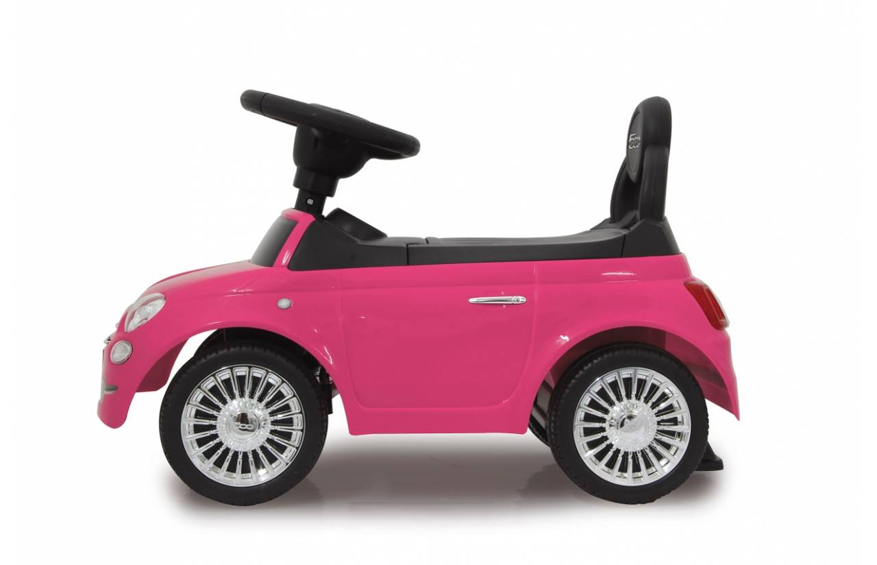 Rosa Kinderfahrzeug zum Draufsetzen in Seitenansicht auf weißem Hintergrund, mit schwarzem Sitz, Lenkrad und silbernen Rädern.