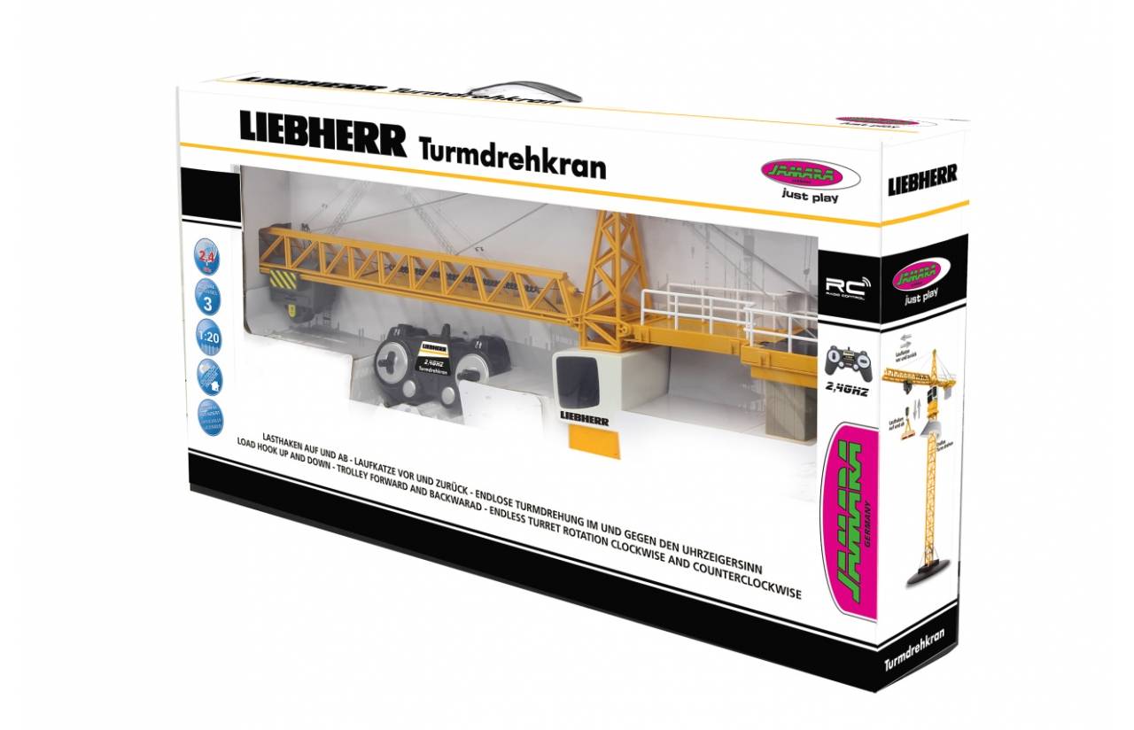 Verpackte Liebherr-Drehkranbahn-Spielzeug mit gelbem Kran, sichtbar durch das transparente Verpackungsfenster.