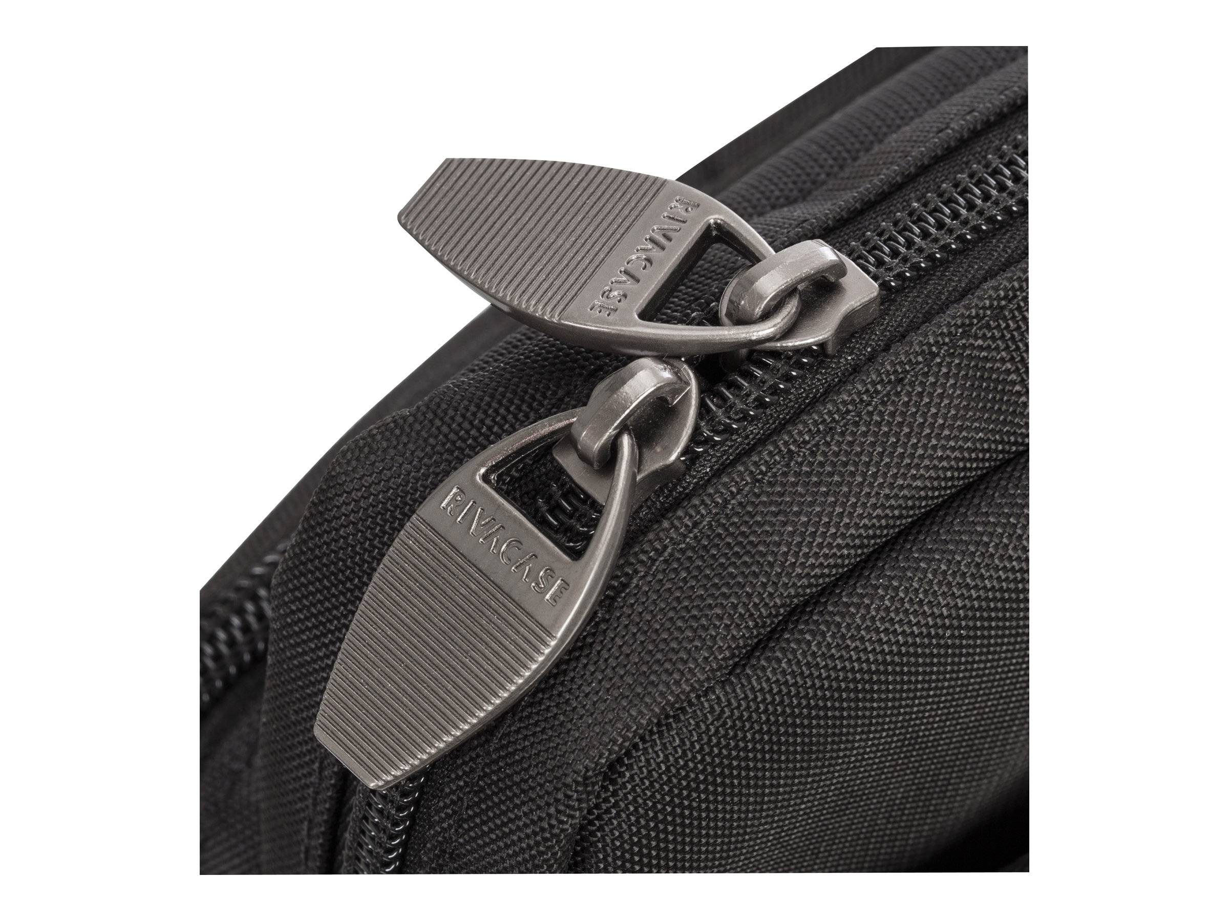 Nahaufnahme eines schwarzen Reißverschlusses auf einer strukturierten Stofftasche, die zwei Metallschieber zeigt, die an der Reißverschlussspur verbunden sind.