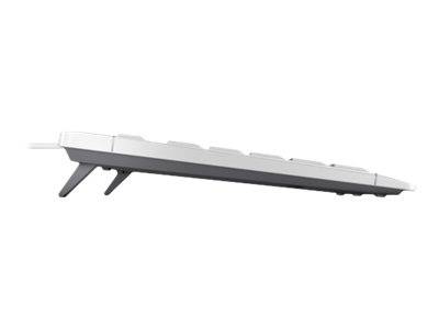 Seitenansicht einer schlanken weißen Computertastatur auf einem einfachen weißen Hintergrund, die ihr flaches Design und abgewinkelte Füße zeigt.
