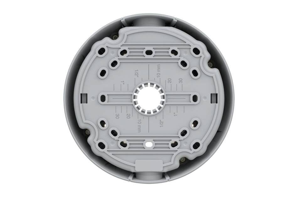 Draufsicht eines kreisförmigen grauen mechanischen Teils mit einer zentralen Öffnung, umliegenden Schlitzen und Montagelöchern, dargestellt auf weißem Hintergrund.