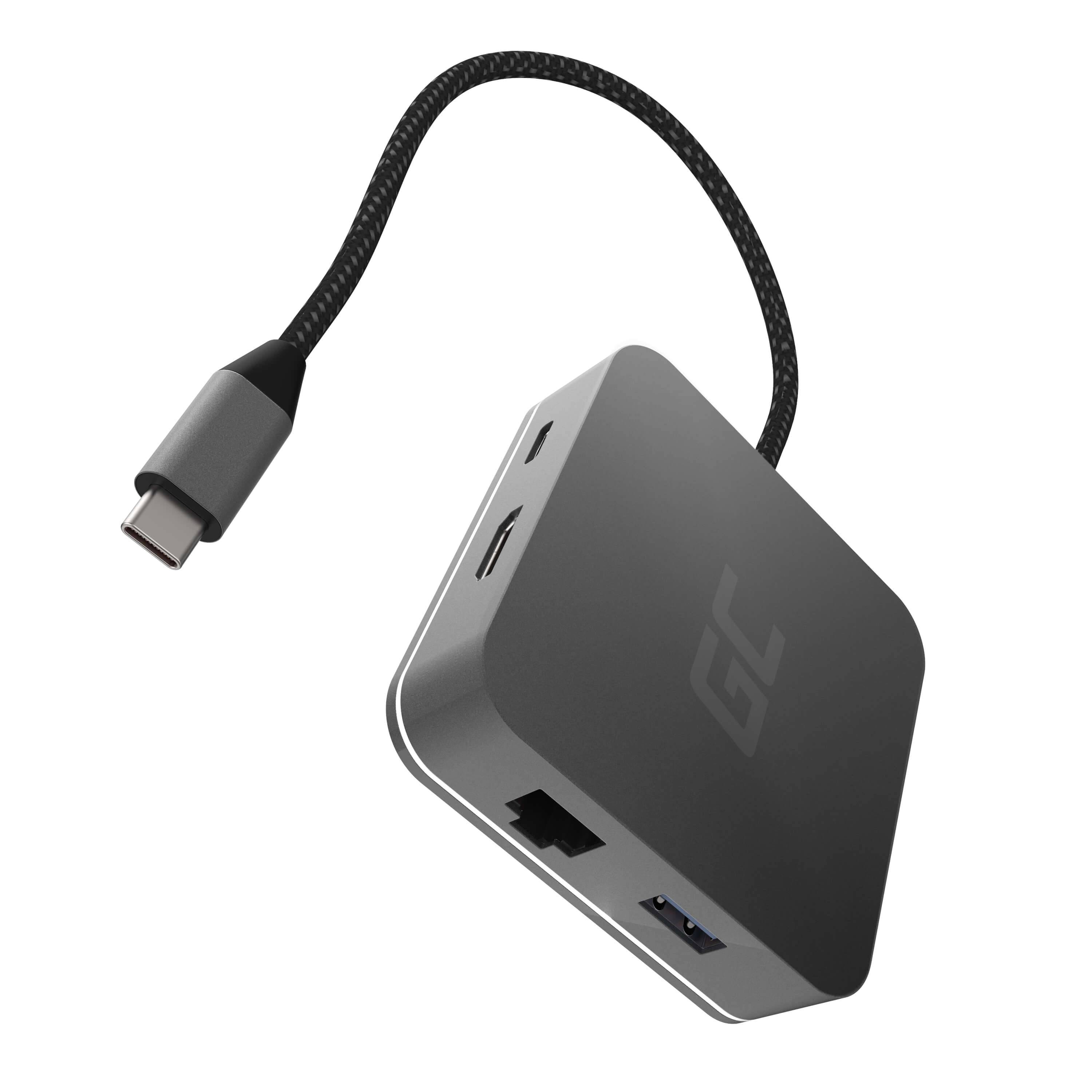 USB-C-Hub mit geflochtenem Kabel mit mehreren Anschlüssen, darunter USB-A, Ethernet und HDMI auf einem kompakten grauen Adapter.