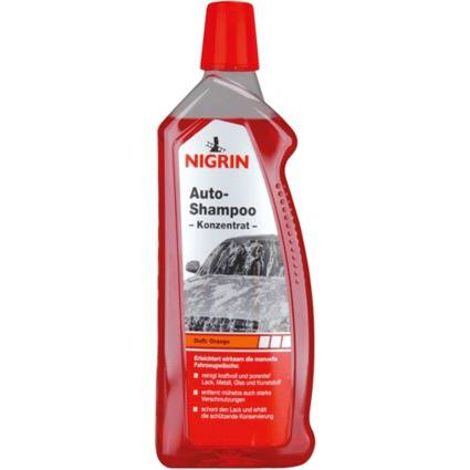 Rote Flasche von NIGRIN Auto-Shampoo Konzentrat, Autowäsche-Shampoo mit Orangenduft, frontal auf weißem Hintergrund dargestellt.