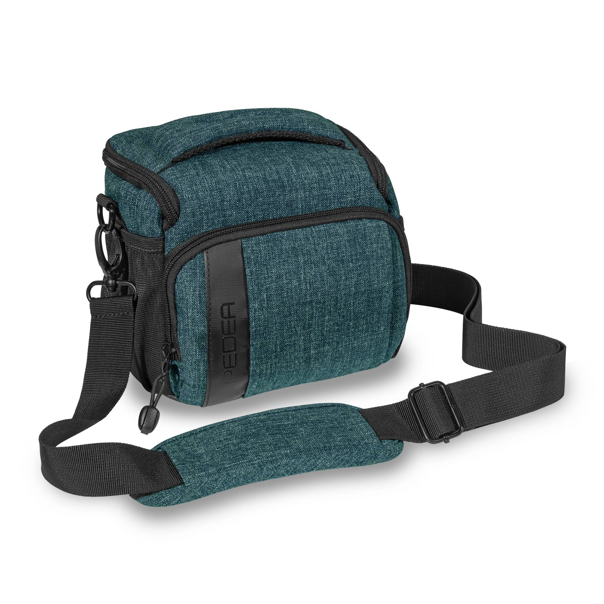Kleine Schultertasche in Teal mit schwarzem Riemen und Reißverschlüssen, vor weißem Hintergrund abgebildet.