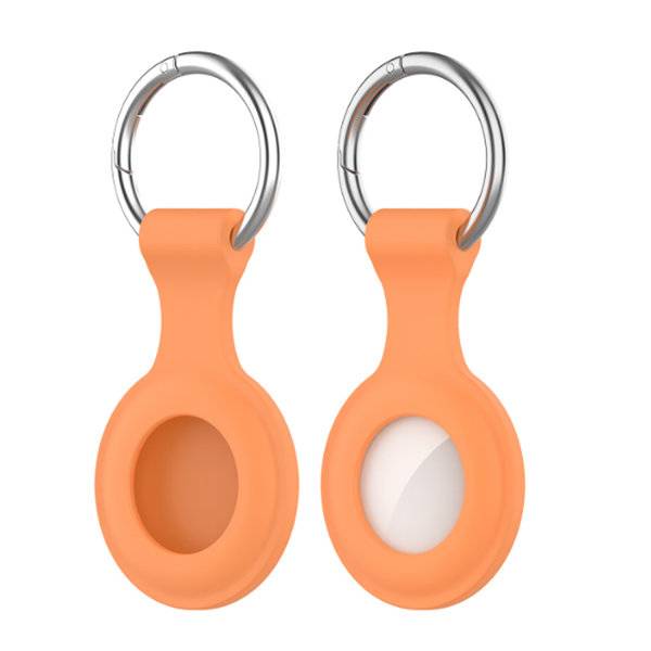 Zwei orange Schlüsselanhänger mit Metallringen, einer mit einer leeren ovalen Vertiefung und einer mit einem weißen ovalen Einsatz.