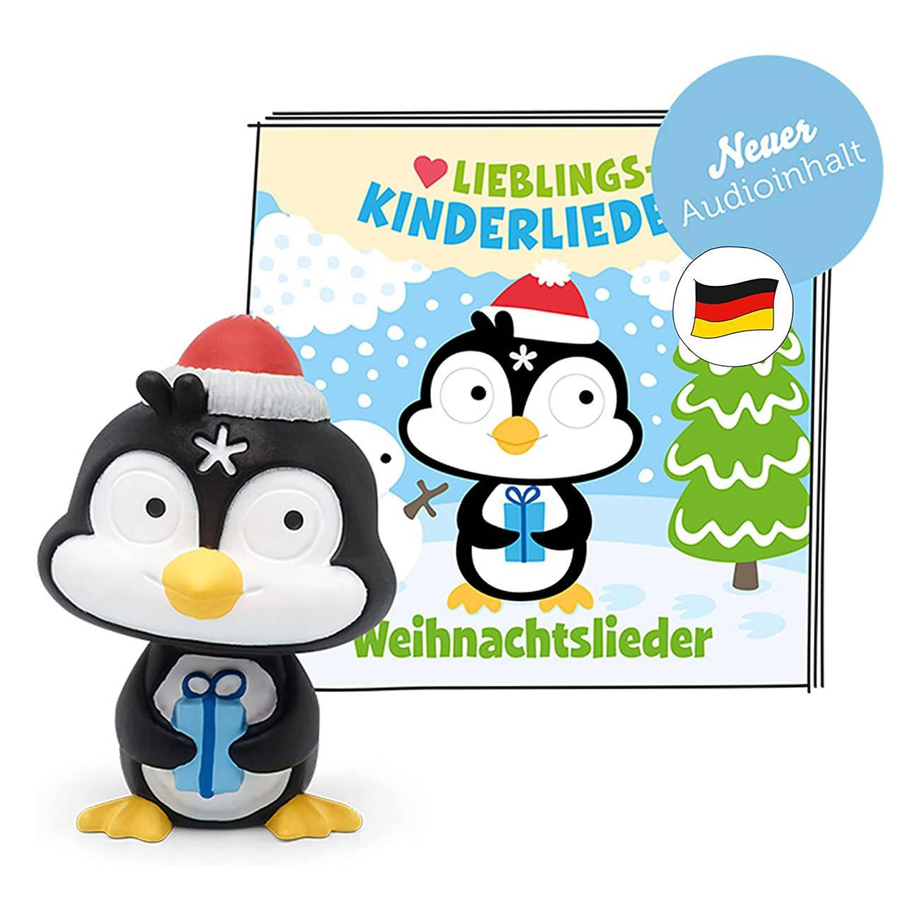 Pinguin-Spielzeug in einer Weihnachtsmütze vor einem Cover eines deutschen Kinder-Weihnachtsliederbuchs mit der Aufschrift „Lieblings Kinderlieder Weihnachtslieder