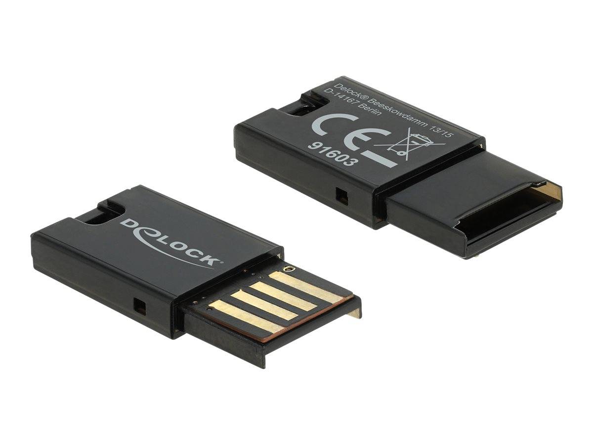 Zwei kleine schwarze USB-Speichersticks, einer von vorne und einer von hinten gezeigt, mit freiliegenden goldenen Steckern und gedruckten Logos auf weißem Hintergrund.